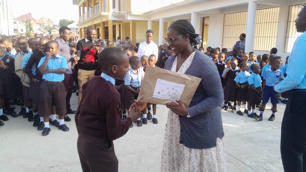 Lusasaro student with teacher — award 2025